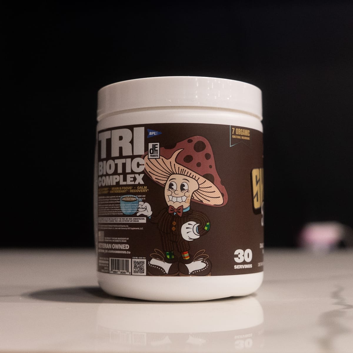 Back label of the Shroombiosis tub — the Tri-Biotic Complex panel with the DE111® and BPL1® marks, directions, and disclaimer